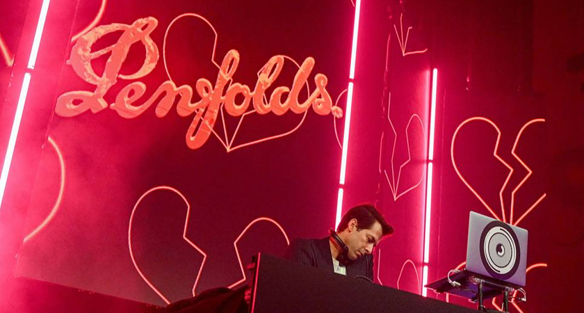 Mark Ronson djing on the main stage.  Penfolds logo appears on display behind him