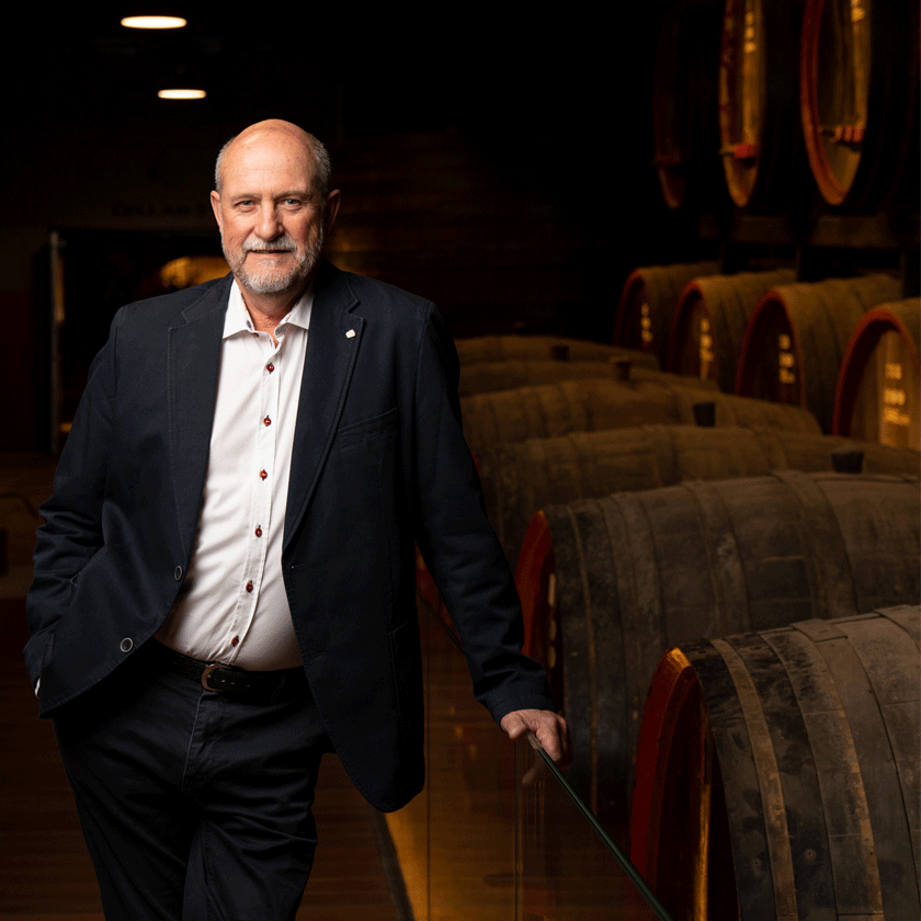 James Godfrey, Penfolds Fortified Winemaker, stands in the warmly lit tunnels of the winery