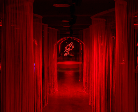 Penfolds logo against red neon background
